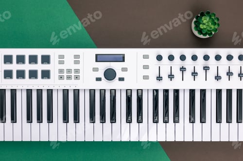 Preview: Music keys on a colored background, flat lay.