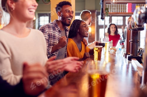 Preview: Group Of Excited Customers In Sports Bar Watching Sporting Event On Television