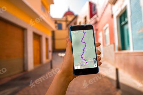 Preview: Smartphone with white screen on the old town street background