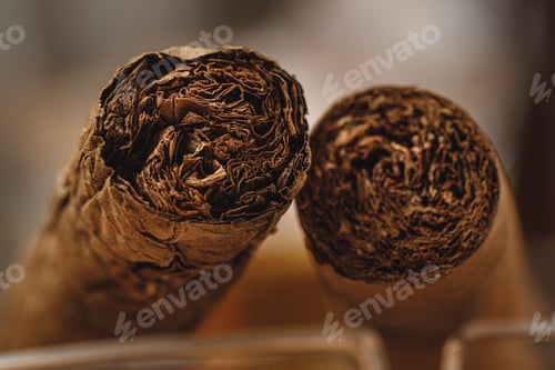 Preview: Pile of new cigars close up on wooden table