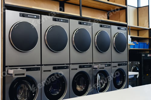 Preview: Line of Dryers and Washing Machines in Self Service Laundry
