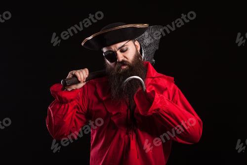 Preview: Thoughtful man in a pirate clothes for carnival with a hook insted of his hand