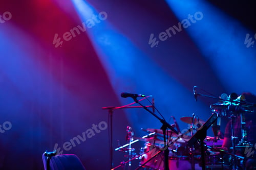 Preview: Colorful stage lights and microphone at concert