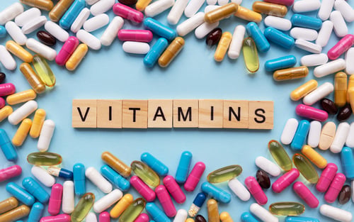 Preview: Different colorful pills from different symptoms in the middle - the inscription from wooden letters