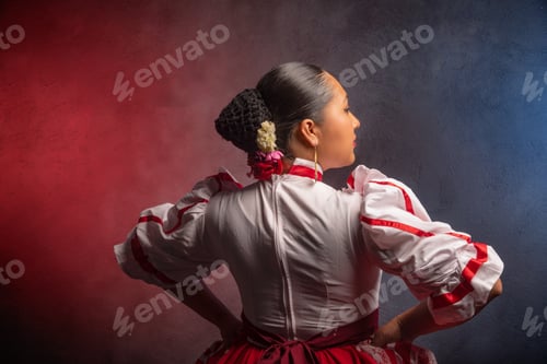 Preview: A woman in a red and white dress is posing for a photo