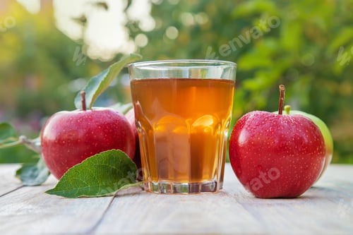 Fresh Apple Juice and Apples on Table