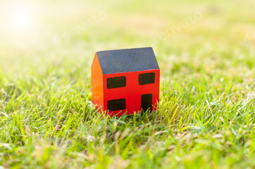 Preview: Wooden toy house on grass