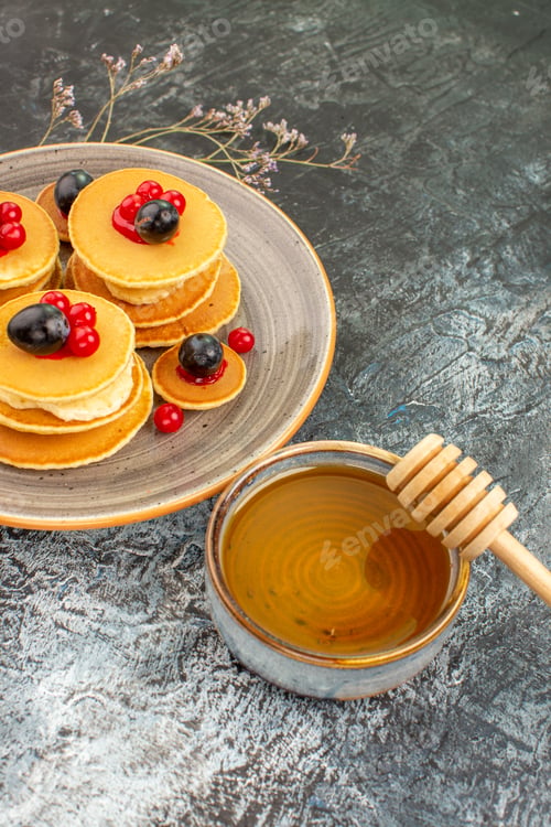 Preview: Breakfast with buttermilk pancakes and honey stock image