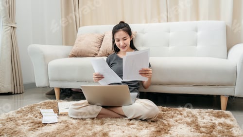 Preview: Young Woman Working on Laptop at Home