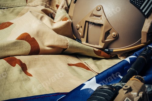 Preview: U.S. battle flag and assault rifle on the wooden table
