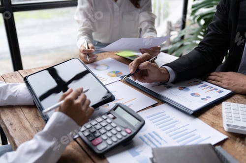 Preview: business people meeting in the office Calculate the tax and income of the company's investment. Stra