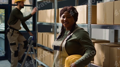 Preview: Cheerful worker in warehouse