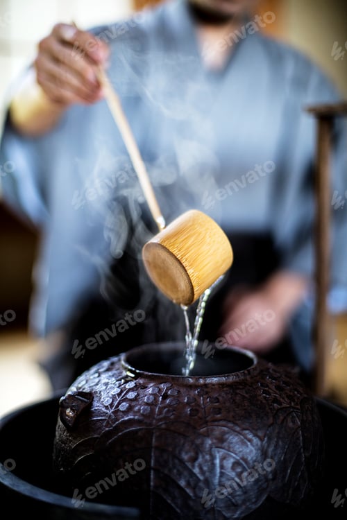 Preview: Traditional Japanese Tea Ceremony, man using a Hishaku, a bamboo ladle in water