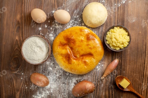 Preview: top view tasty pumpkin pie with flour on a brown wooden desk pie cake hotcake bake oven