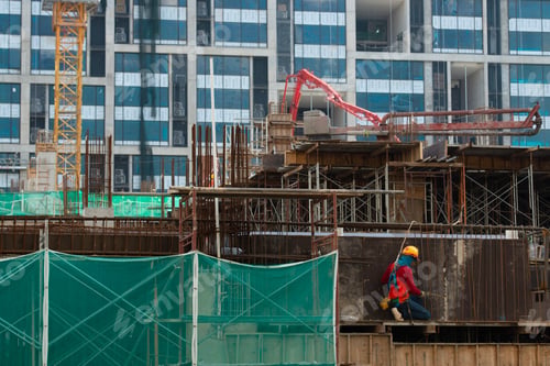 Preview: Construction workers fabricating steel reinforcement bar at the construction site