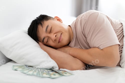 Preview: Asian man sleeping with bunch of cash dollars under pillow