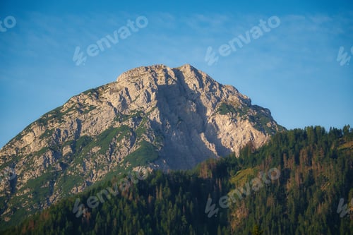 Preview: Scenic view of the mountains under a blue sky in Dobbiaco, South Tyrol, Italy.