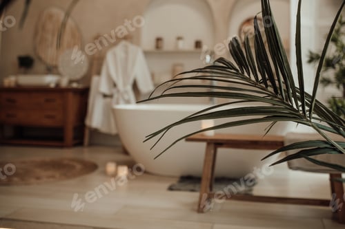 Preview: Luxury interior of big bathroom at modern african style with oval bathtub in natural lighting