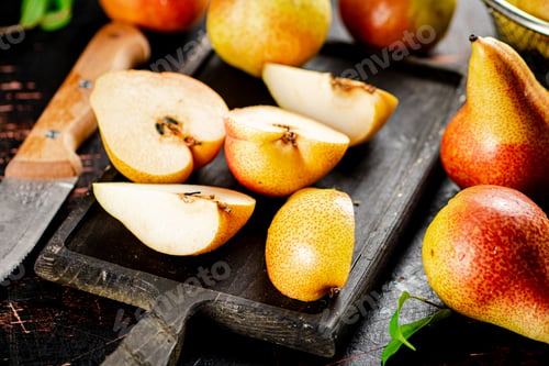 Preview: Sliced fresh pear on a cutting board.