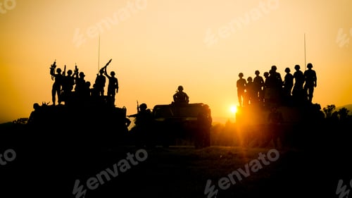 Preview: military ammo tanks on the field against sunset.