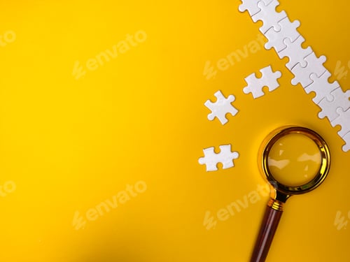 Preview: Magnifying glass searching missing puzzle on yellow background