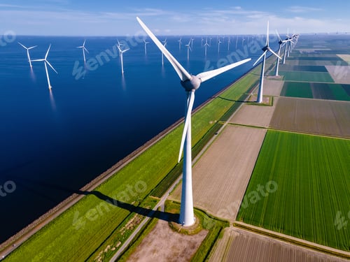 Preview: windmill park with a blue sky on a sunny day in the Netherlands, biggest windmill park in the ocean