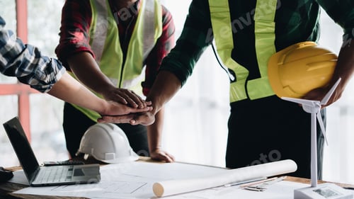 Preview: Team job of teamwork engineer work together in a construction site with business concept.