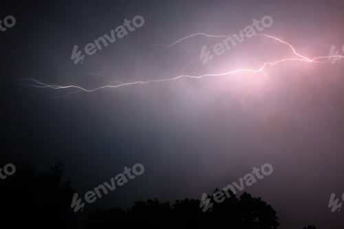 Preview: Lightning Storm. A dramatic lightning storm in the night sky with striking lightning bolts.
