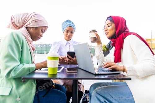 Preview: Beautiful muslim girl wearing hijab bonding outdoors