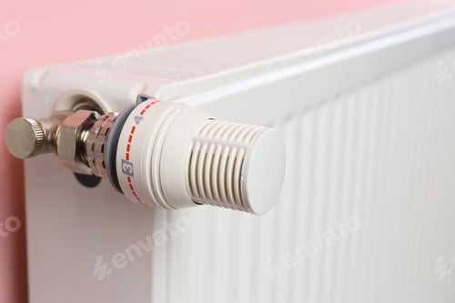 Preview: Heating radiator with temperature adjuster on color wall