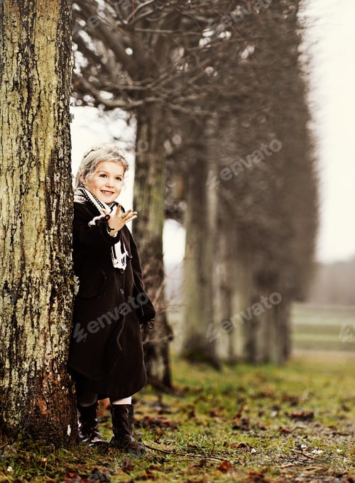 Preview: Girl leaning against tree in countryside, Copenhagen, Denmark