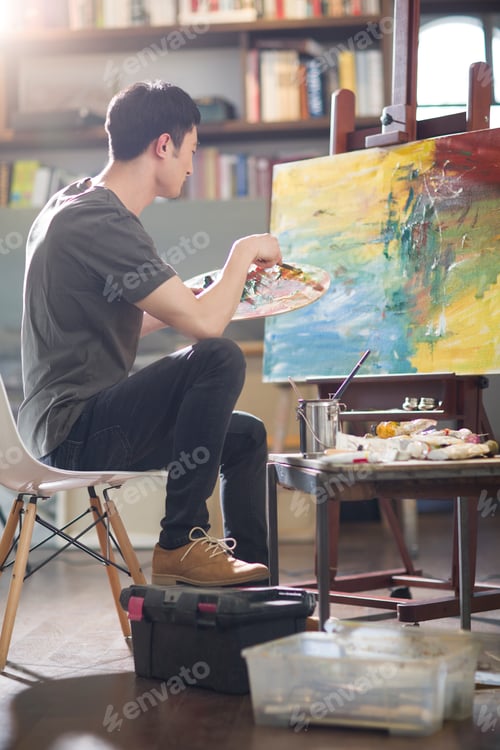 Preview: Artist painting in his studio