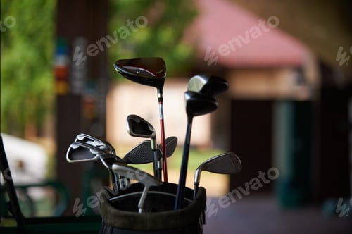 Preview: golf clubs on the background of a green lawn