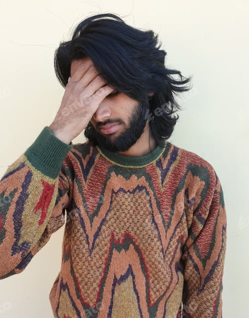 Preview: Photo of a tired young guy, A good looking young man with beard and long hair