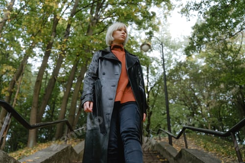 Preview: a girl with a serious face walks forward looks around, in a black cloak