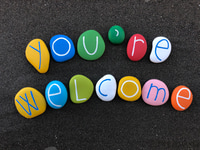 Preview: Colorful Pebbles Spell Out a Welcoming Message
