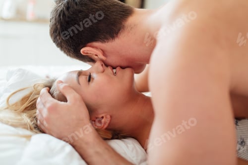 Preview: Couple in love lying on bed
