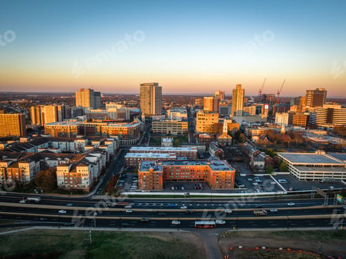 Preview: Drone view of a city with buildings illuminated by sun rays in New Brunswick, Rutgers, Hub City, USA