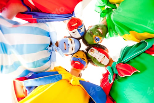 Preview: Group Of Latin People With Flags Painted On Their Face