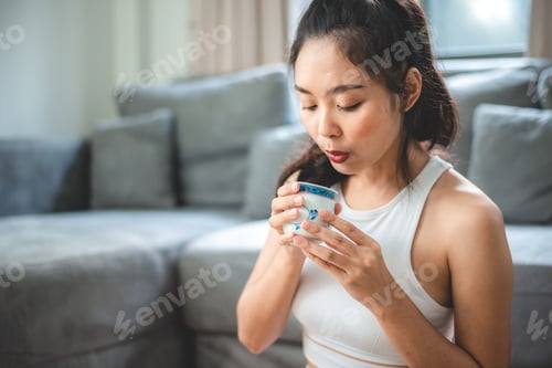 Preview: Asian woman person relaxing with hot tea to drink at home, tea cup for happy lifestyle in morning