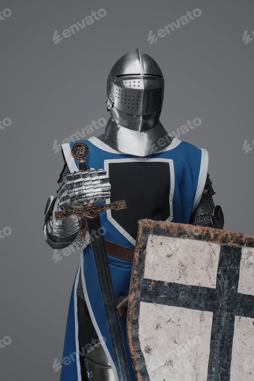 Preview: Medieval knight in blue surcoat holding a sword and shield