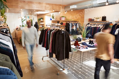 Preview: People walking through a busy clothes shop, motion blur