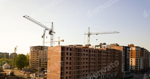 Preview: High multi storey residential apartment buildings under construction. Concrete and brick framing of