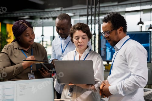 Preview: Teamworking programmers brainstorming ways to develop applications in office