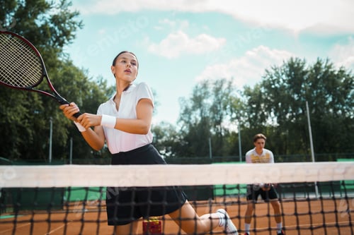Preview: Young couple playing tennis