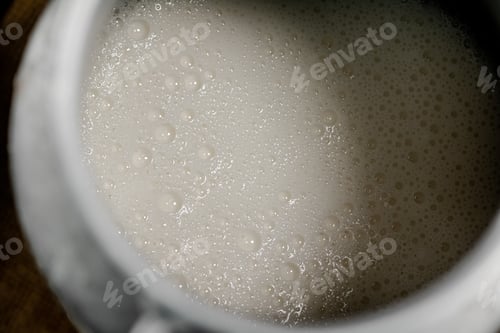 Preview: Village milk in a can. Macro background.
