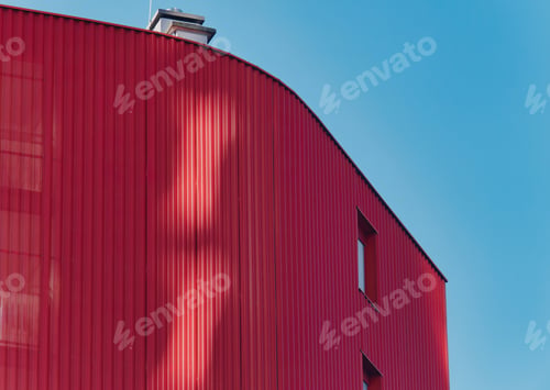 Preview: Daylight shot of a red building on the background of blue sky