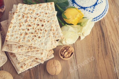 Preview: Passover celebration concept. Matzah, red kosher and walnut. Traditional ritual Jewish bread matzah,