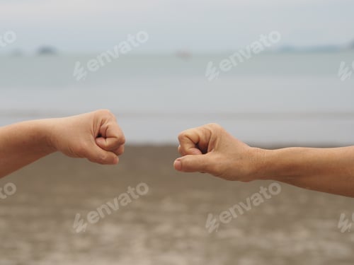Preview: Two woman Alternative handshakes fist clenched hand