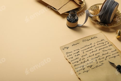 Preview: Letter with text, ink bottle and vintage plates on beige background, space for text